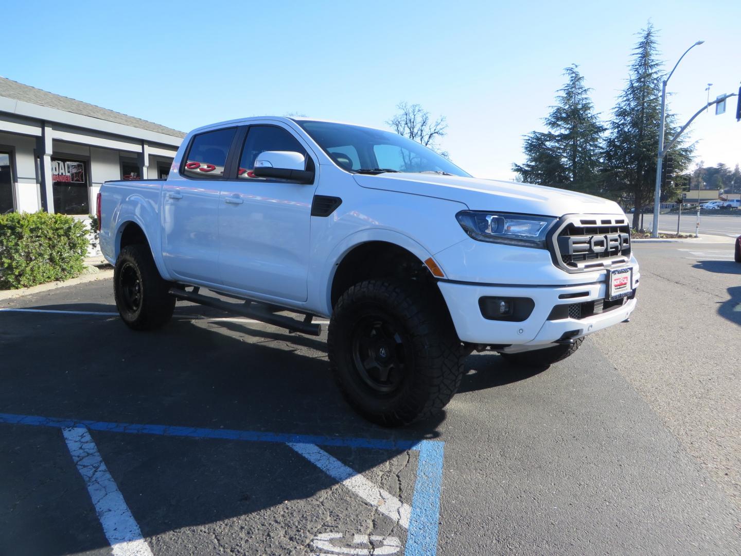 2019 White /Black Ford Ranger Lariat (1FTER4FHXKL) with an 2.3L engine, automatic transmission, located at 2630 Grass Valley Highway, Auburn, CA, 95603, (530) 508-5100, 38.937893, -121.095482 - Features a Fabtech suspension system, Fuel Offroad wheels, Nitto Ridge Grappler tires, Westin Running boards, and a Bakflip. - Photo#2